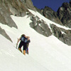 05 051 LeeAnn follows John B on summit Chief Mtn (192k)